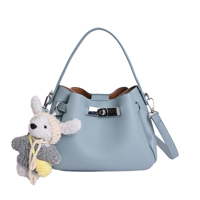 Coreano de nicho de alta calidad canasta de verduras, bolso de cubo de mano para mujeres 2026 nuevo estilo extranjero, lujo ligero y versátil bolso de mochila