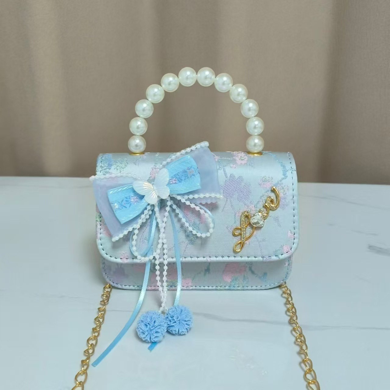 Bolsos infantiles de alto nivel antiguo bolso de cambio de niña pequeña princesa de perlas accesorios de ropa Han bolso de almacenamiento