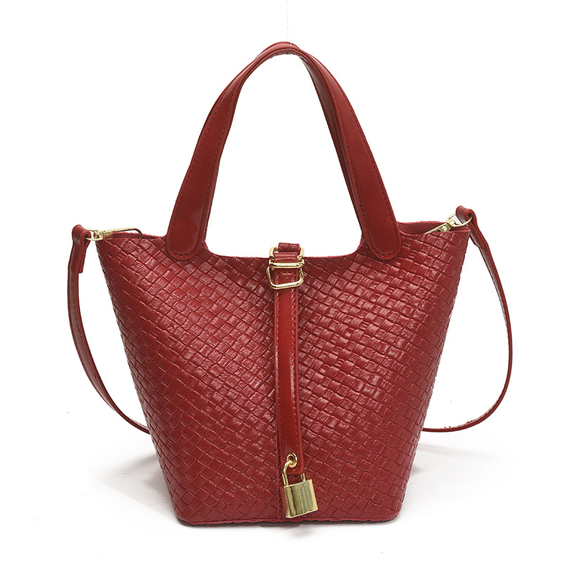 Bolso de cubo portátil con patrón tejido para mujer 2025 nuevo estilo coreano de lujo ligero de alta gama bolso de mensajero para niños de nicho