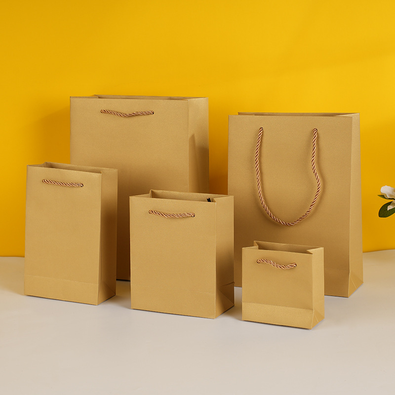 in stock Golden Handbag Golden Special Paper Bag Advertising Shopping Gift Bag Jewelry Gift Box Packaging Paper Bag in stock Golden Handbag Golden Special Paper Bag Advertising Shopping Gift Bag Jewelry Gift Box Packaging Paper Bag