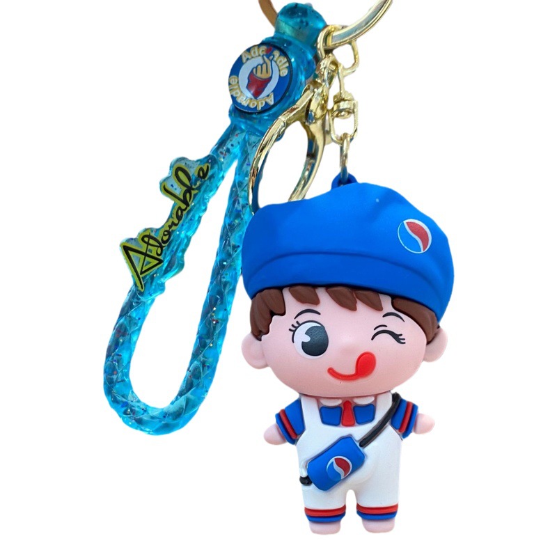 Dibujos Animados bebida soda pareja llavero lindo muñeca mochila colgante llavero bebé captura máquina pequeño regalo al por mayor