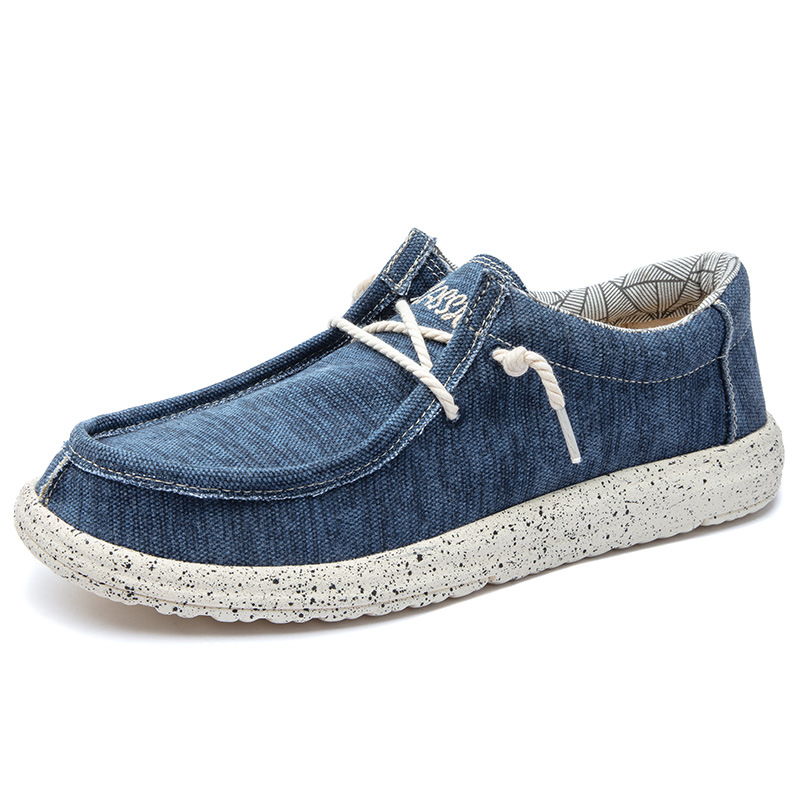 2025 al por mayor de primavera de mediana edad nuevos zapatos casuales de hombre zapatos de tela transpirables zapatos de lona PU ligeros zapatos de pedaleos