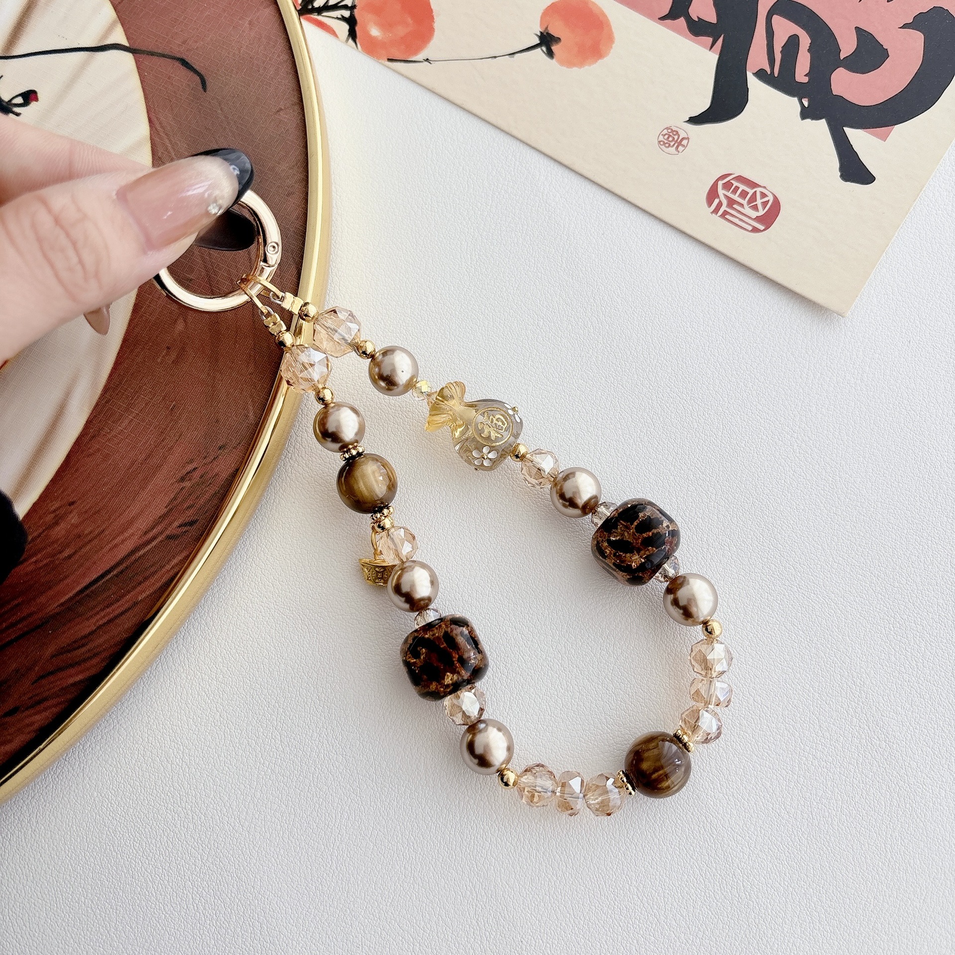 La sensación de alto nivel de lujo ligero bolso Fuyuan Bao cadena de teléfono móvil cadena de teléfono móvil bolso llavero colgante nicho diseño