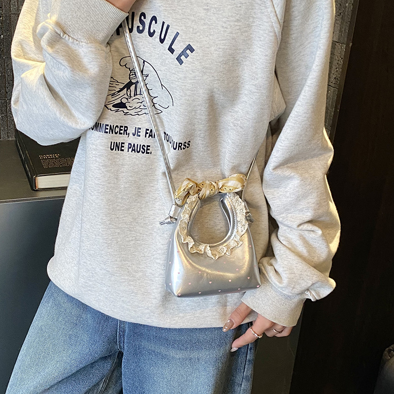 Pequeño arco fresco bolso de hombro de niñas bolso de encaje extranjero amor ondulado mini bolso para niños