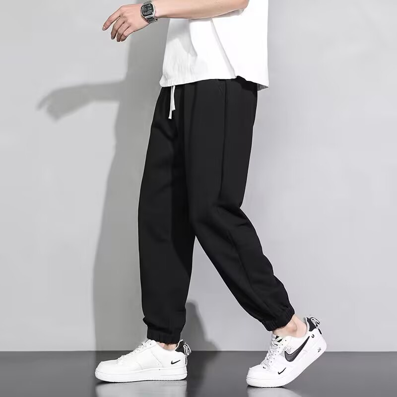 垂れ下がった感じの広腿のズボンの男性の夏のゆったりしたストレートの男性の黒色の運動の衛のズボンの春秋のタイプのカジュアルなズボンの夏