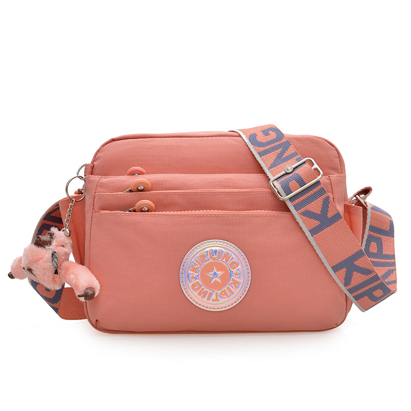 Nuevo bolso de hombro para mujer kp bolso de mensajero de tela de nailon anti-salpicaduras ultraligero nuevo colgante de mono estándar damas compras diagonales