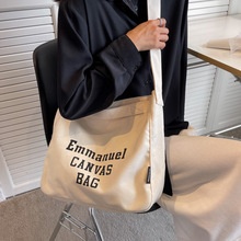 學院學生時尚街頭書包2022新款簡約印花大容量電腦斜挎單肩帆布包