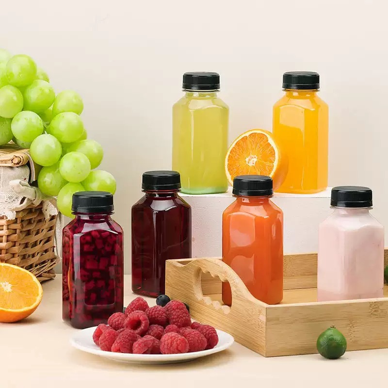 Fabricante spot 38 botella de té de leche cuadrada botella de bebida transparente de plástico con tapa botella vacía de jugo de red de grado alimenticio