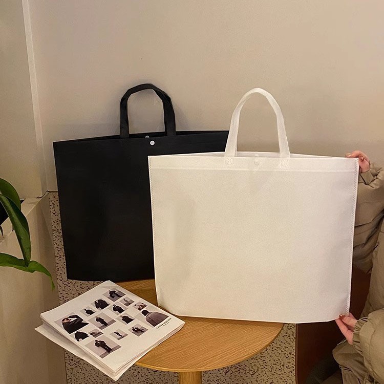 Tienda de ropa de alta gama con fondo, sin hebilla oculta lateral, bolso no tejido, engrosamiento, logotipo de pedido, spot al por mayor