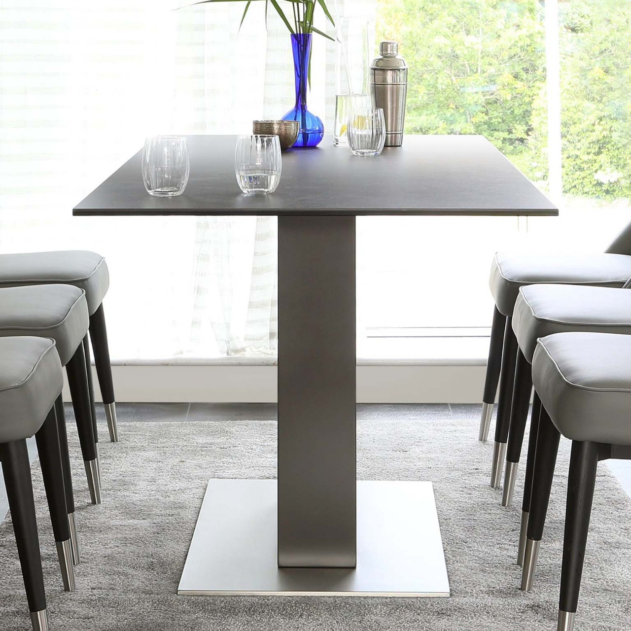Mesa de comedor de vidrio temperado mesa de comedor de lujo ligera alta sensación mesa de tabla de roca moderna simple mesa de comedor silla
