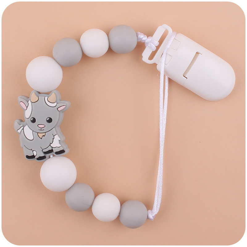 Nuevo bebé suministros chupete cadena creativa de dibujos animados Cordero silicona bebé mordedura cadena anti-gota molar