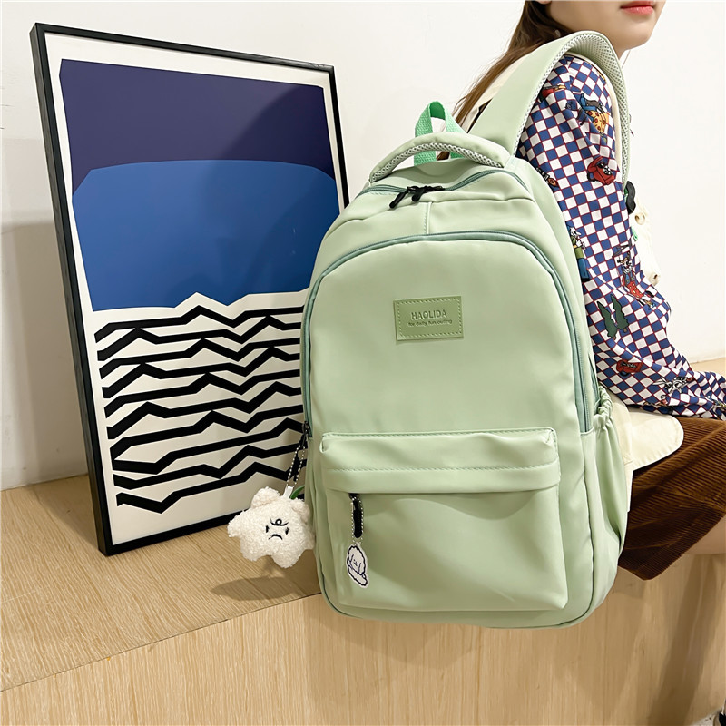 Mochila de las mujeres nuevo nylon color sólido estudiante de la escuela secundaria mochila de gran capacidad simple todo-fósforo estudiante universitario mochila impermeable