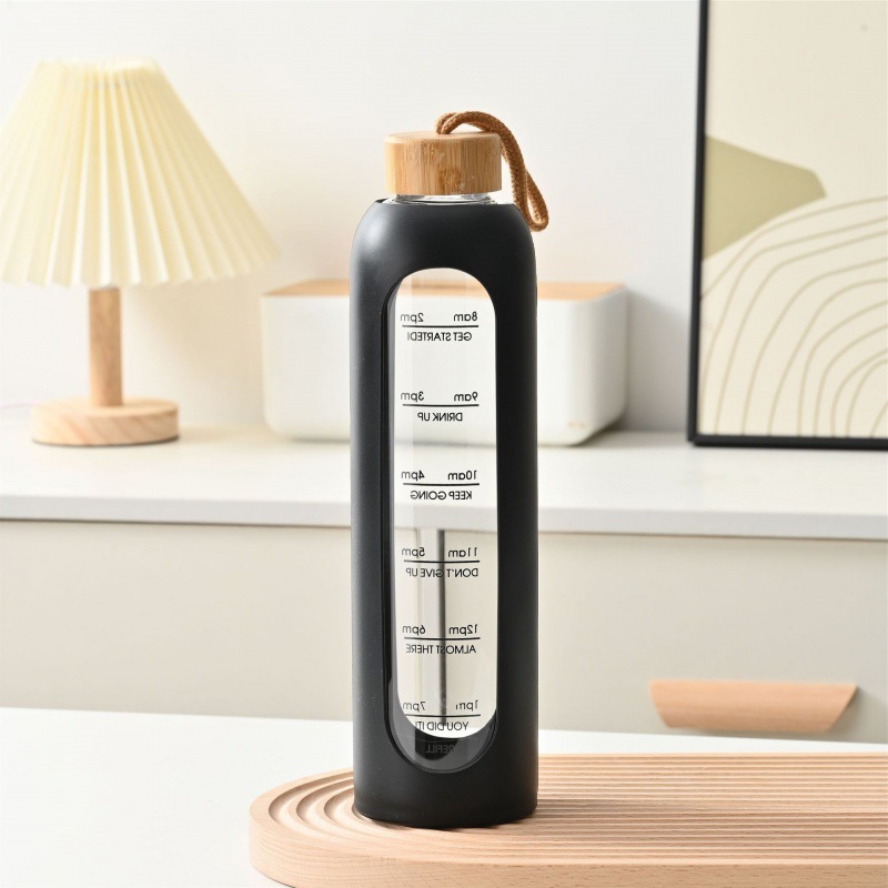 Taza de vidrio con tapa de bambú de gran capacidad transfronteriza, cuerda de elevación, cubierta de silicona portátil, taza de agua graduada, botella de agua deportiva de vidrio de alto valor