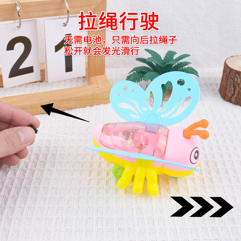 Juguetes de dibujos animados para niños abejas de cuerda de tracción mariposas flash jardín de infantes pequeños regalos al por mayor