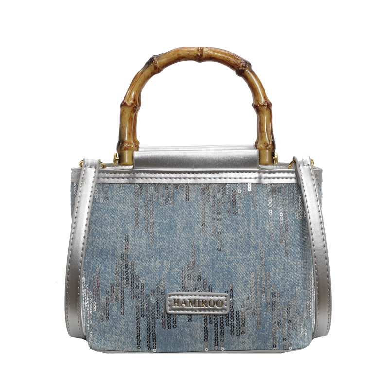 Bolso de mano de bambú para mujeres 2025 nuevo verano bolso de balde de vaquín coreano bolso de hombro mochila de moda