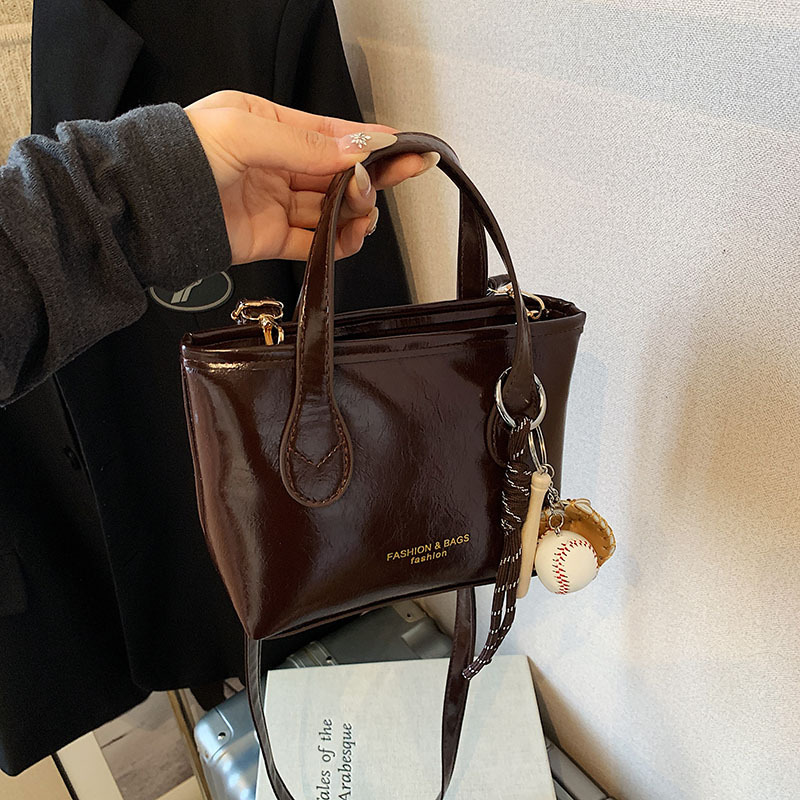 Bolso de cubo de textura de color sólido para mujer 2025 primavera nueva moda bolso de mensajero coreano estilo occidental de alta gama para mujer