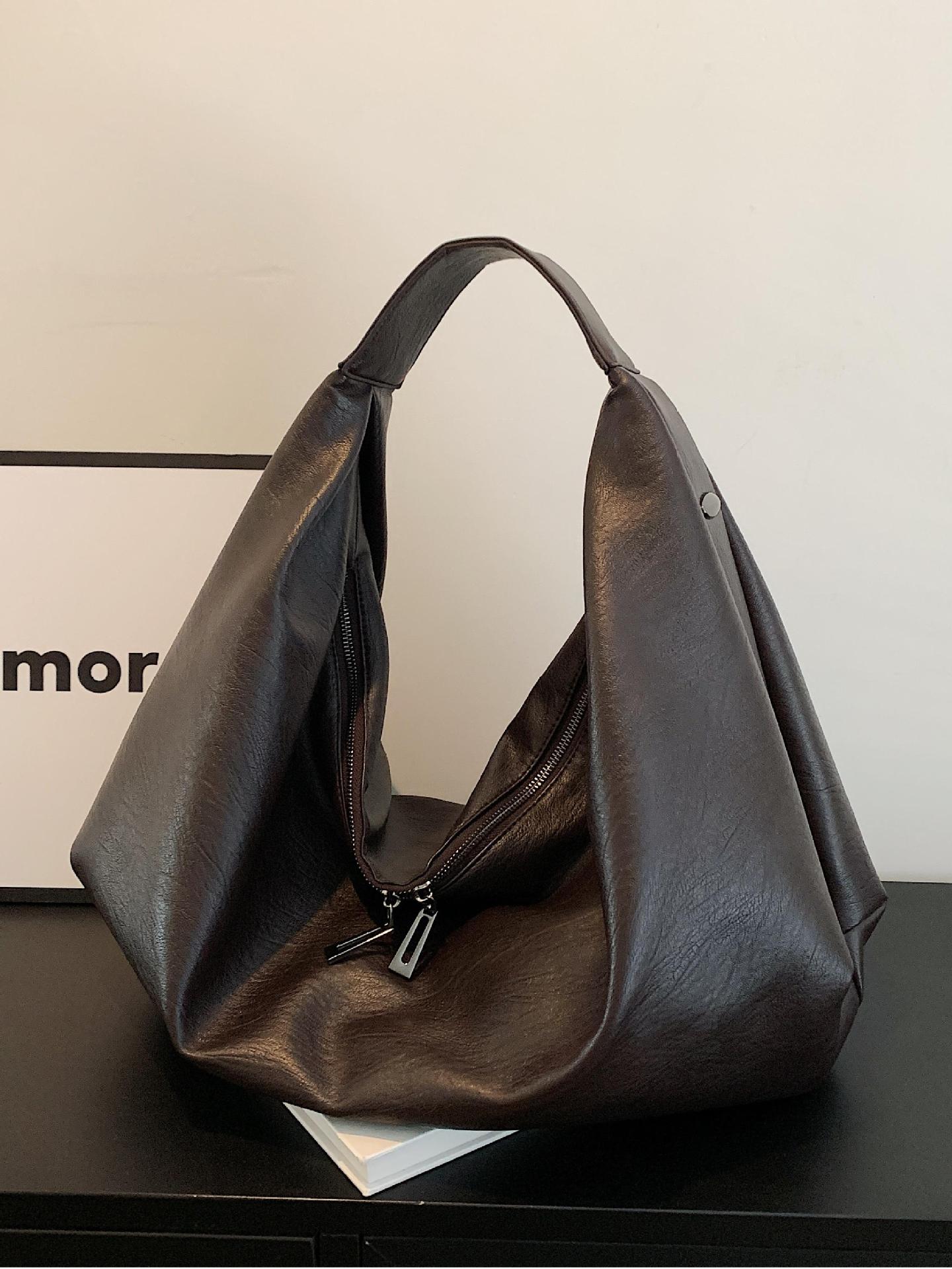 Bolsa de brazo explosiva transfronteriza para mujeres 2025, nueva bolsa de hombro de cuero suave casual simple, gran capacidad, bolsa de mano alta.