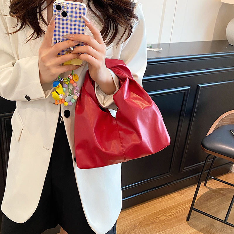 Diseño de nicho, bolso de mano de alta gama, primavera y verano, nueva moda, todo fósforo, simple, color sólido, bolso de mano casual, mujer