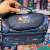 Blue astronauts hand withdrawal meal bag