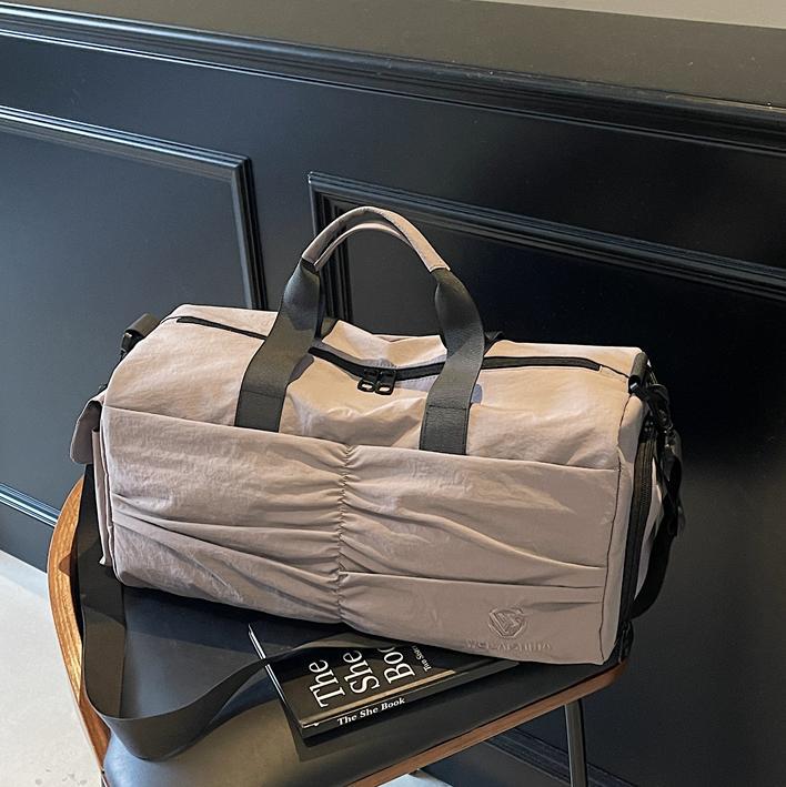 Bolso deportivo coreano transfronterizo femenino 2025 nueva bolsa de almacenamiento separada seca y húmeda bolsa de viaje de viaje