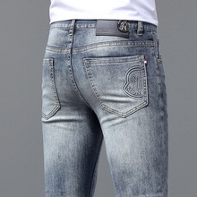 香港2025春夏新款弹力牛仔裤男潮牌水洗磨白修身小脚韩版百搭裤子