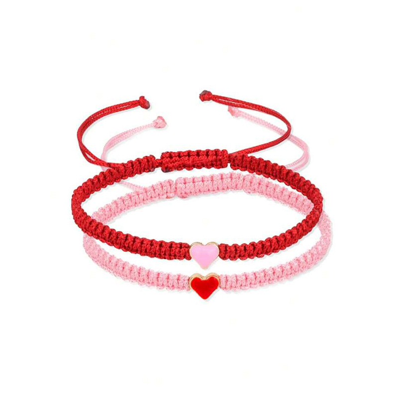 Joyería transfronteriza europea y americana en forma de corazón pulsera tejida a mano pulsera de pareja de amor de las mujeres pulsera de corazón de melocotón blanco y negro al por mayor