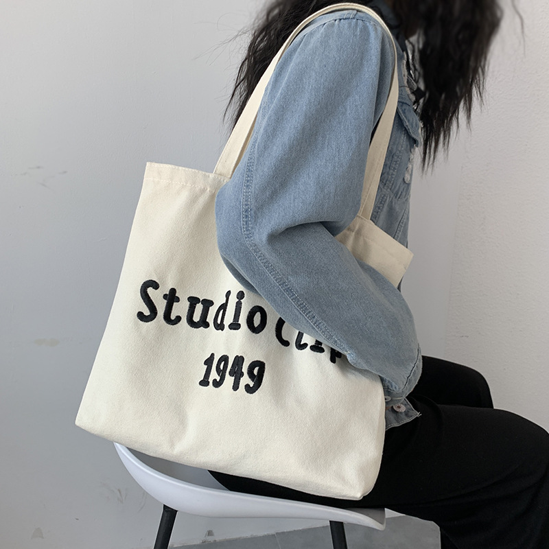 Estilo chino bordado bolsa de lona de los hombres femeninos de hombro nicho original simple letras artísticas de gran capacidad bolso de escuela del estudiante