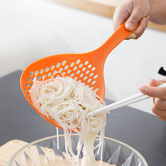 Large slotted strainer with long handle, ideal for household kitchens—perfect for high-temperature use when draining noodles, tossing pasta, or serving dumplings and more.