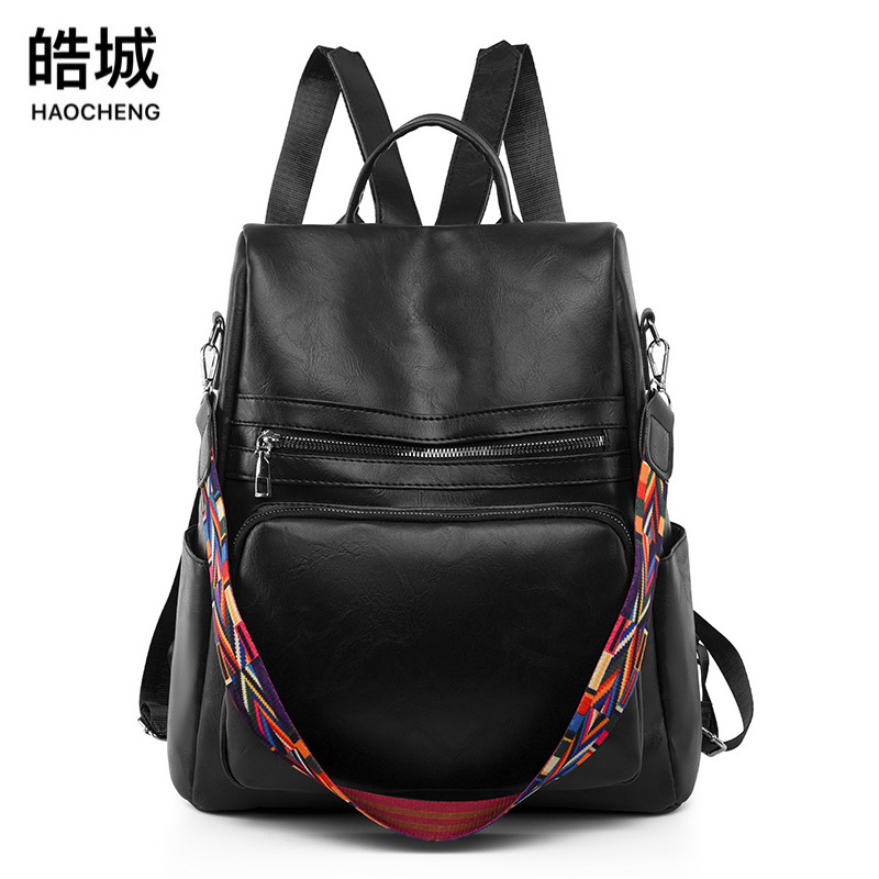 Comercio exterior al por mayor 2023 nueva mochila antirrobo para mujer PU moda hombro simple color sólido mochila de viaje de doble uso