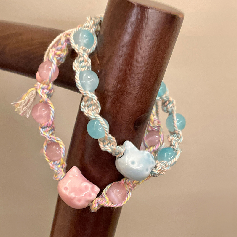Pulsera de cuerda de color de gatito de cerámica linda de dibujos animados, pulsera de todo fósforo de nicho dulce, joyería de temperamento de alta gama de moda para mujer