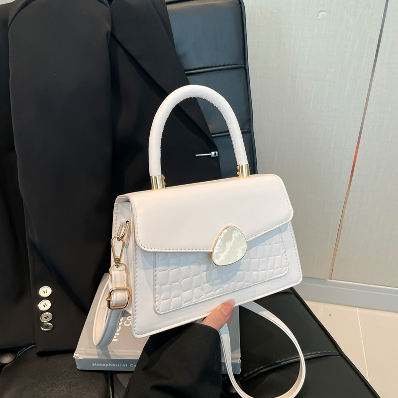 Textura hebilla magnética bolso de moda simple 2025 primavera nuevo estilo ins bolso de mensajero de un solo hombro elegante bolso cuadrado femenino