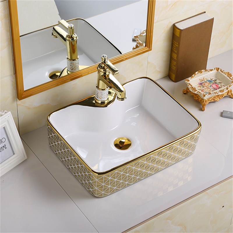 Exportación de alta temperatura color oro tablero lavabo lavabo de cerámica ligera de lujo fábrica de hotel lavabo galvanizado al por mayor