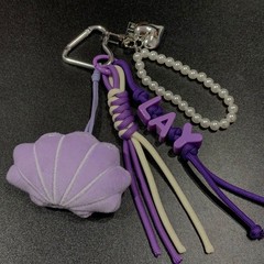 張芸興貝殻の女の子の専属の包みは紫色の応援のスターの周辺の自家製の装飾の創意の贈り物を掛けます。