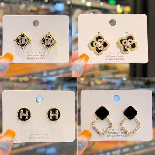 High-quality wholesale black silver needle earrings with micro-engraving design, niche light luxury series stud earrings, retro temperament earrings.
