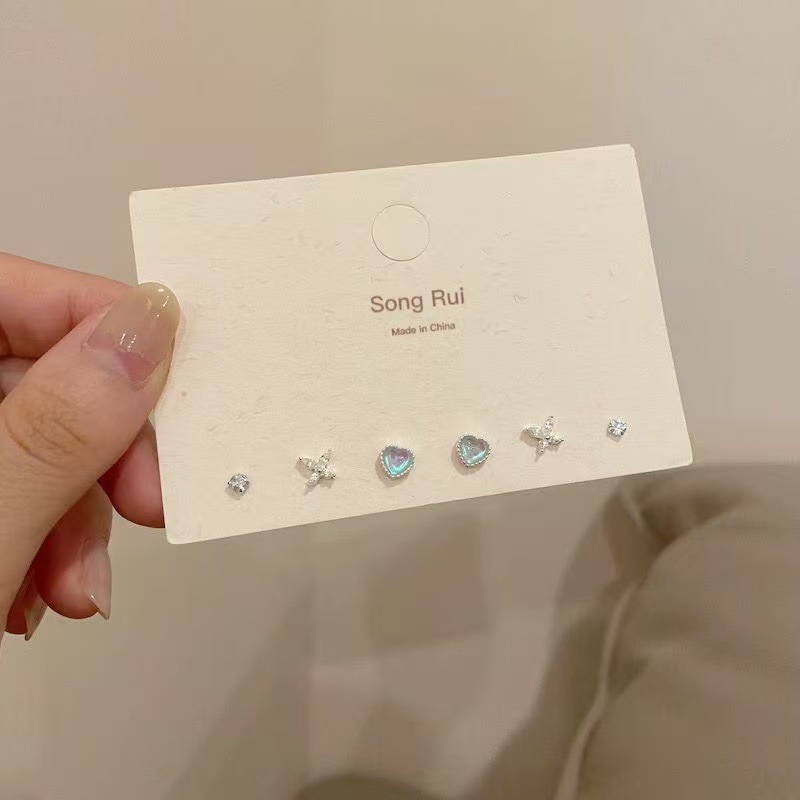 Pendientes redondos de color de aguja de plata Pendientes frescos y dulces Pendientes de todo fósforo de moda simple para mujer