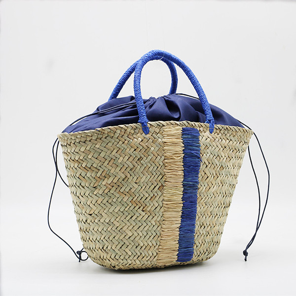 handheld straw blue black woven aquatic plants
