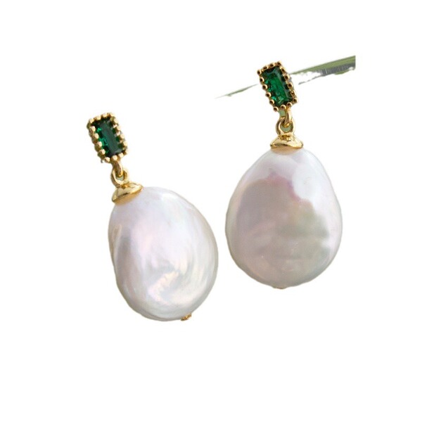 Organic earrings from pearl with bow heart shaped with tassels