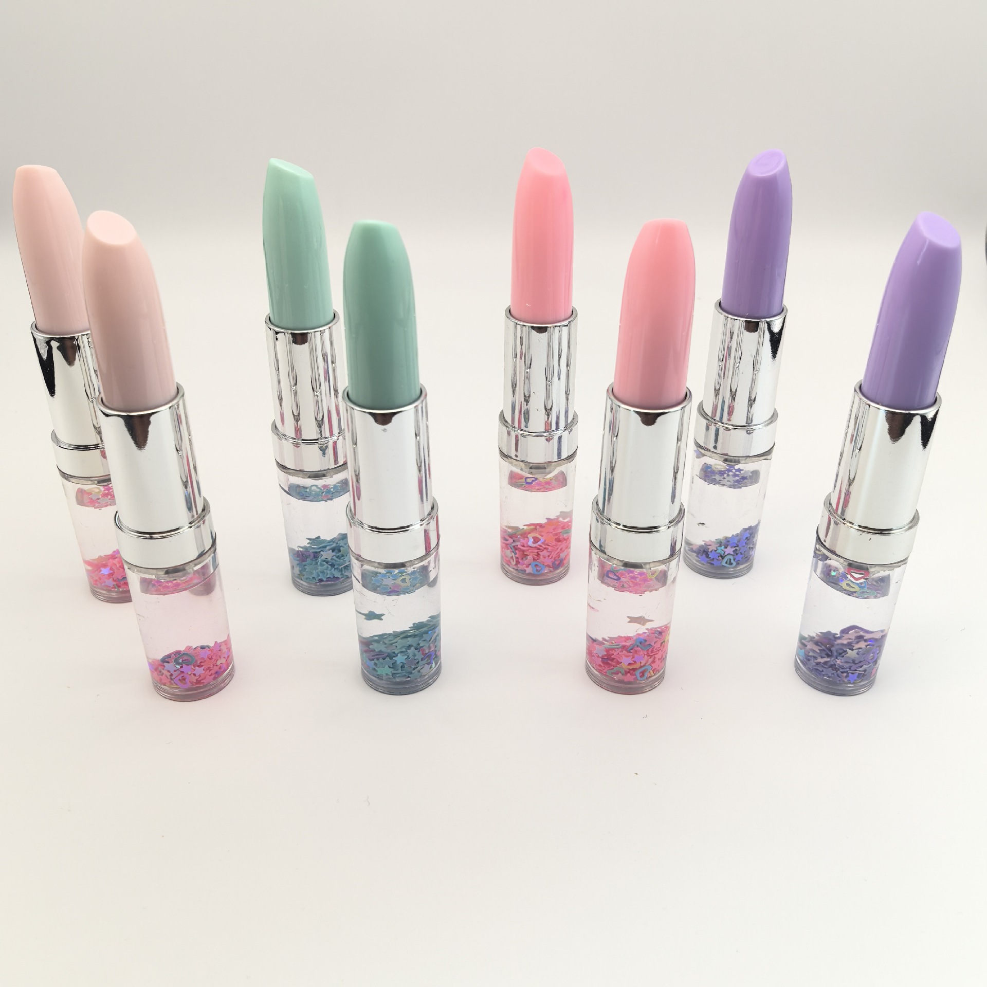 Fábrica de suministro directo de arena flotante sequinilla lápiz labial PVC lápiz labial estilo lápiz de bola japonés coreano lindo papelero conjunto lápiz