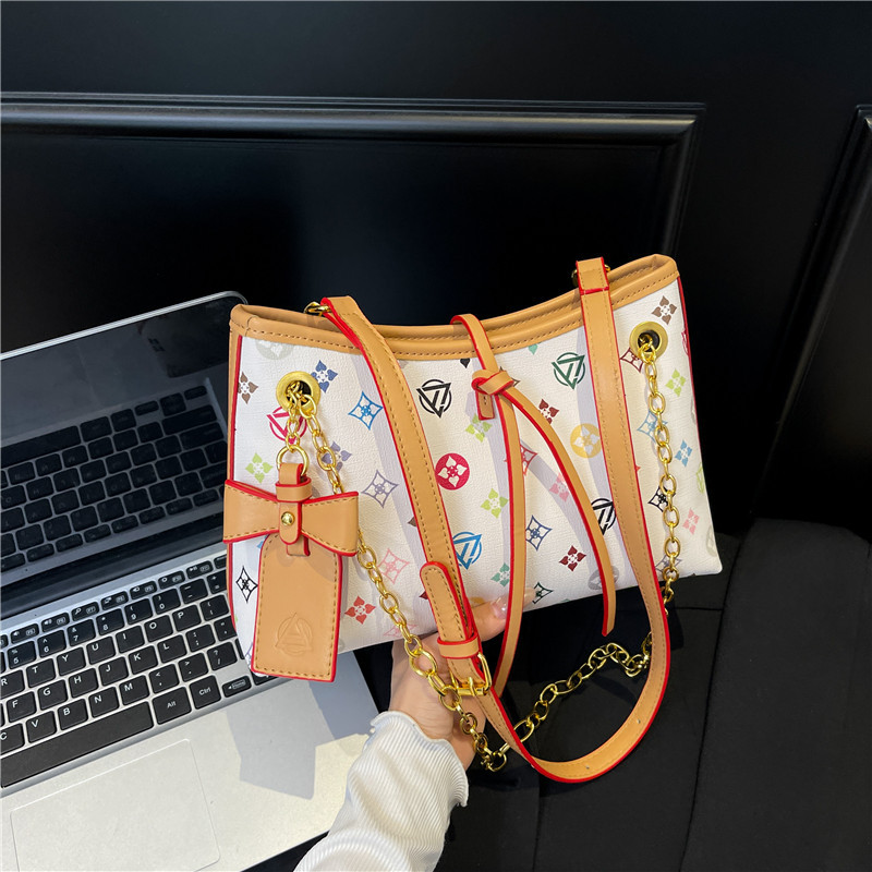 Bolso de cadena de textura transfronteriza 2025 verano nuevo bolso femenino retro bowknot bandolera moda contraste color bandolera