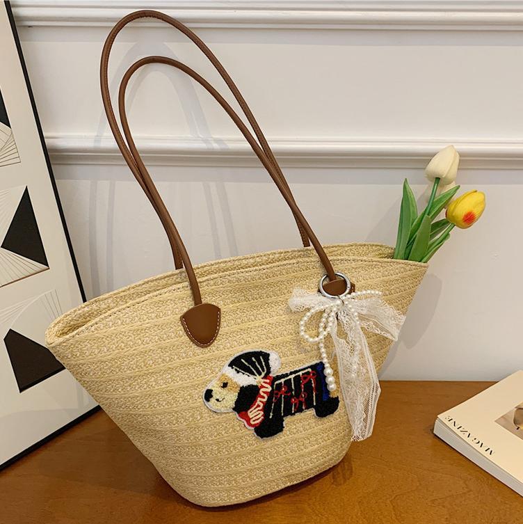 Venta caliente de verano bolso tejido caliente femenino 2025 nuevo bolso de cubo de playa de vacaciones bolso de paja de gran capacidad