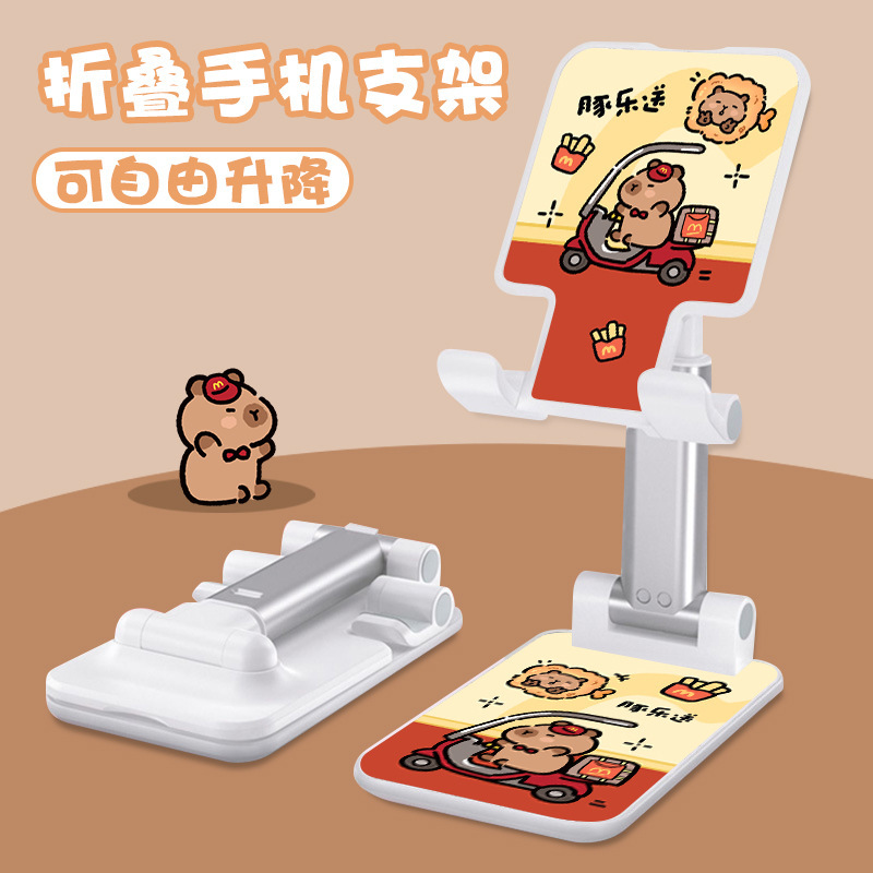 Kt猫の漫画の携帯電話の支柱はタブレットの怠け者のデスクトップの新型の生放送のネット課の神器のベッドの頭の折り畳みの支柱を適用します。|undefined