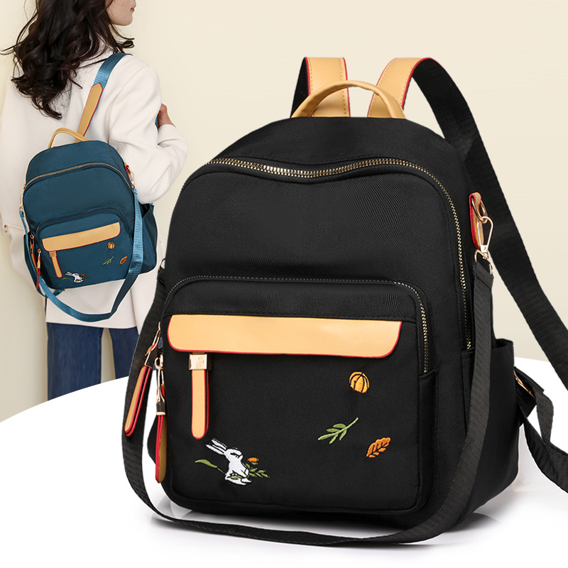 2024 nueva mochila para mujer, mochila de bordado de ocio de gran capacidad, mochila de viaje de viaje de nailon ligero al por mayor