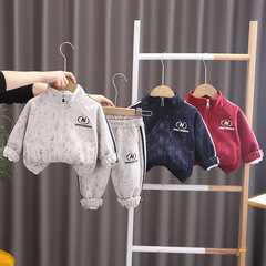 子供の春の服のスーツの男女の子供の2025春のタイプの洋風のコートの春のスポーツの2つのセットのメーカーの卸売り