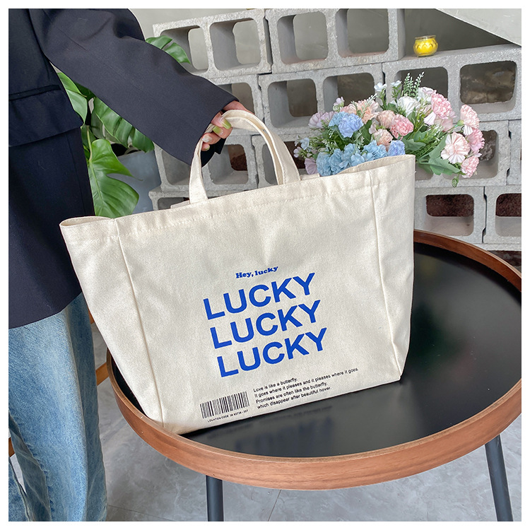 A large-capacity, sturdy Japanese-style canvas bag for women, a new 2022 simple bento handbag for girls to go to work undefined