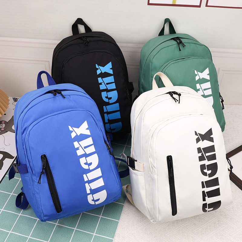 Mochila de moda de moda para hombres 2023 nueva mochila de hombro femenina de gran capacidad de letras de escuela secundaria mochila escolar