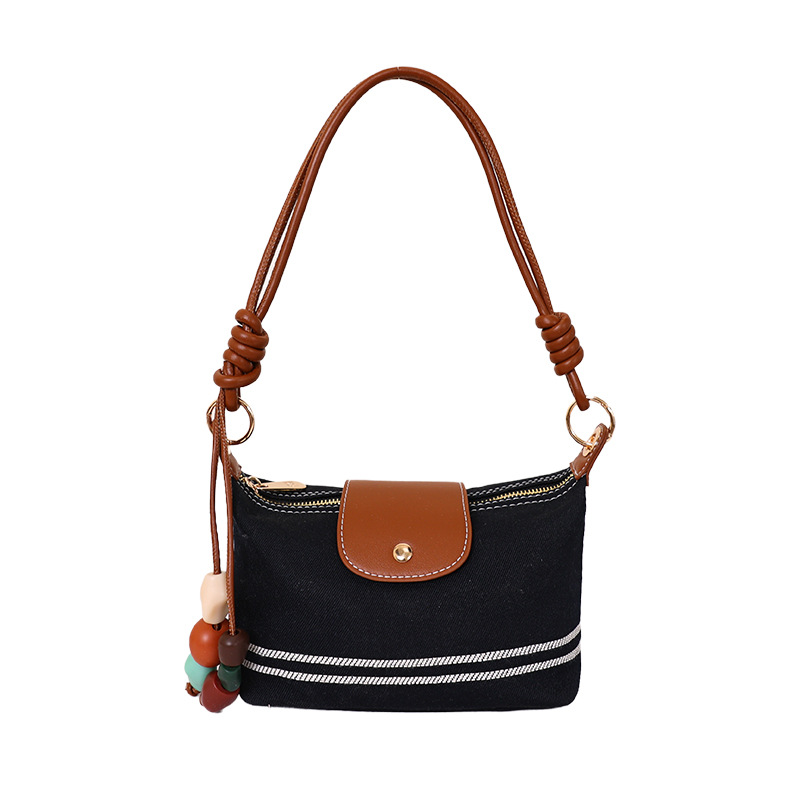La versión coreana de nicho de diseño minimalista bolso de brazo para mujeres verano 2026 nuevo estilo extranjero versátil bolso de mochila casual diario