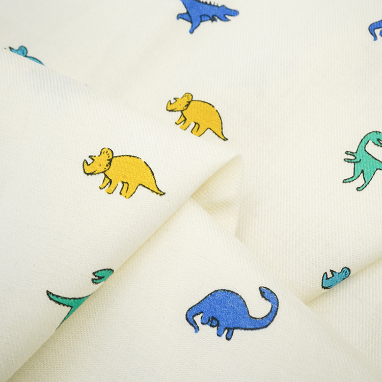 Roll textiles al por mayor 40s dinosaurios dibujos animados patrón de impresión digital ropa de algodón