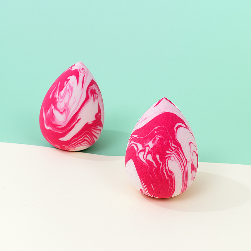 La borla de polvo de huevo de belleza de color mixto transfronterizo se agranda cuando se encuentra con el agua, gotitas de agua, esponja de maquillaje sin látex en forma de calabaza, personalización de fábrica de huevos