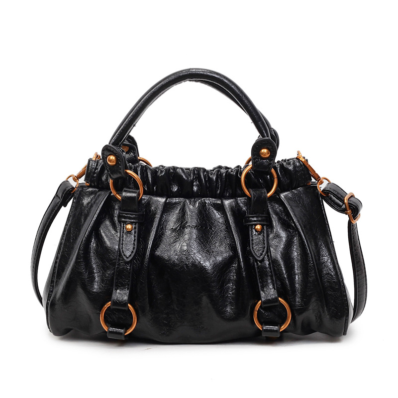 Retro bolso de mano plegable mujer 2025 otoño y invierno nuevo nicho de diseño bolso de cubo de viaje mochila de hombro