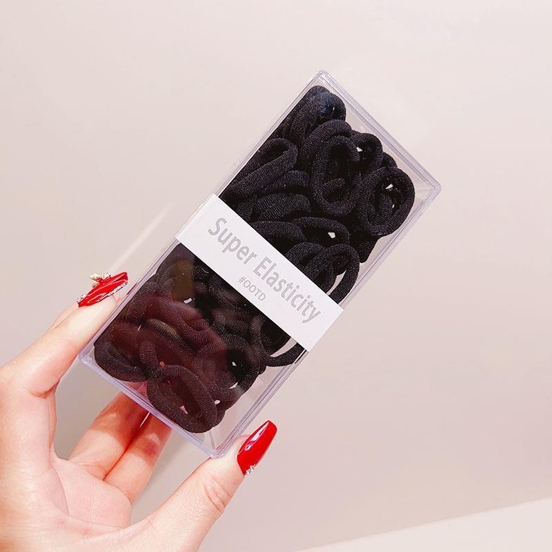 Asequible caja de almacenamiento de Corea del Sur de los niños pequeño tamaño cabeza cuerda bebé toalla anillo no duele pelo cabeza cuerda macaron pelo anillo